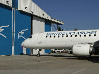 978439_montenegroairlinesembraer195atpodgoricaairportjpeg